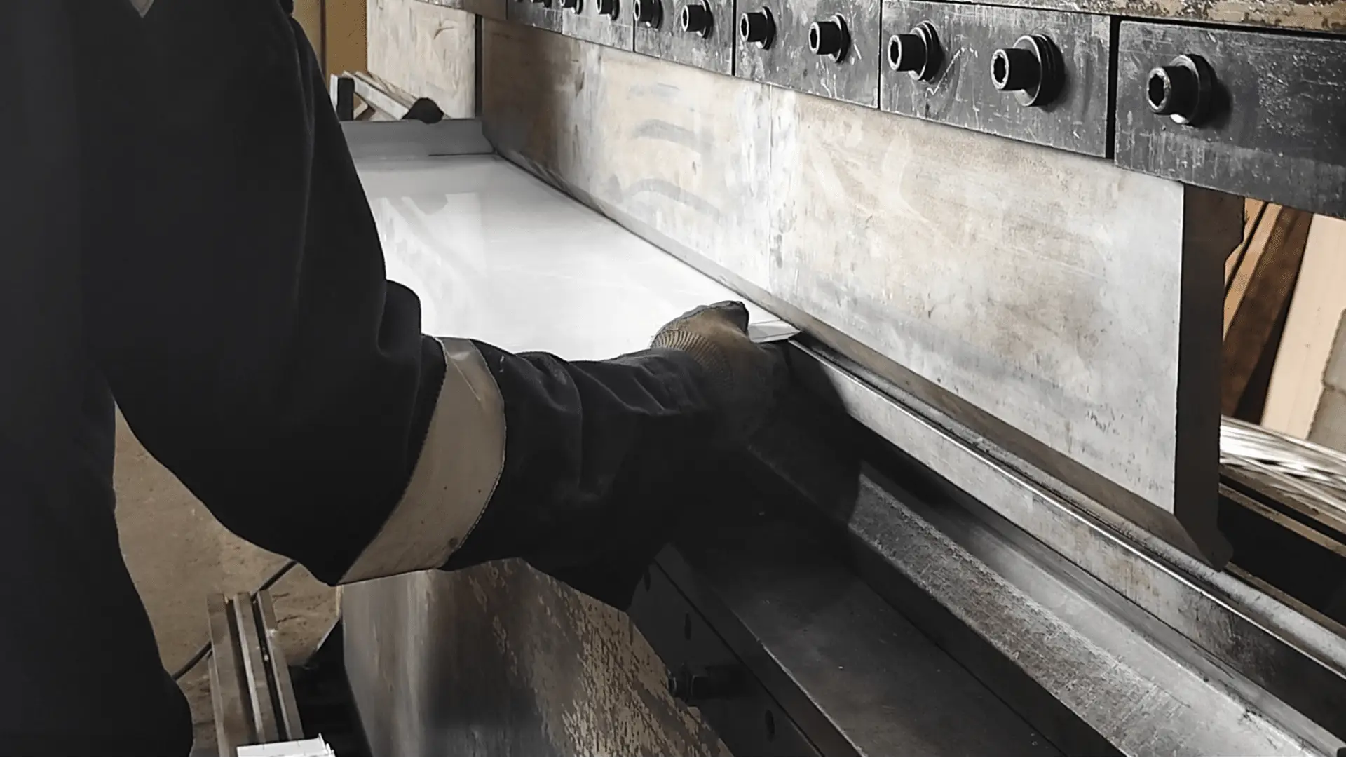 Person holding a piece of metal