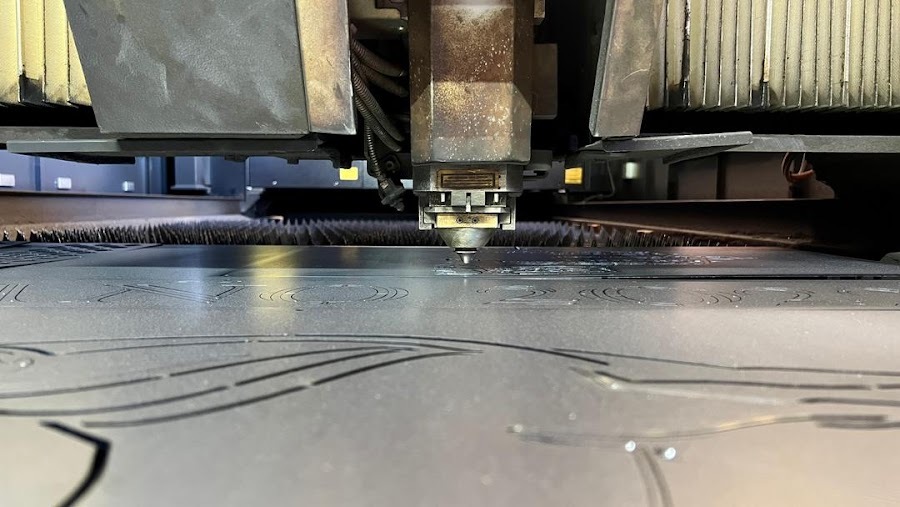 CNC cutting head tracing a nested part path across sheet steel in Columbus Ohio